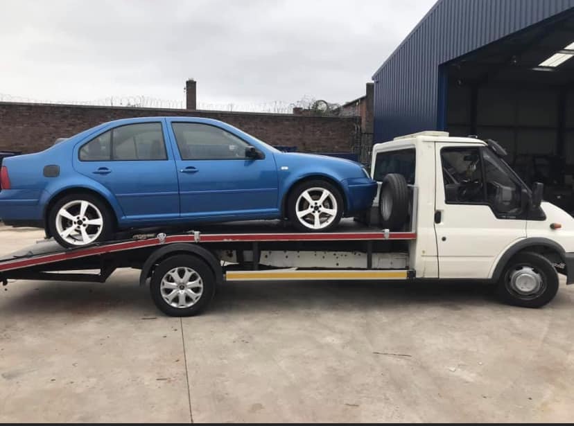 Blue VW Bora collected at scrap yard in Birkenhead