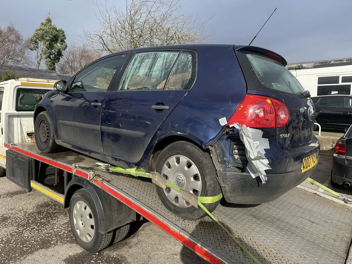 Damaged VW Golf collected for scrap in Merseyside
